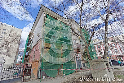 Nizhny Novgorod, Russia. - April 27.2018. Hasty repairs and painting of the facades of buildings near the football stadium on Mura Editorial Stock Photo
