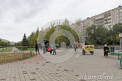 Nizhny Novgorod, Russia. - October 06.2017. Entertainment for the children the opportunity to ride on a pony or a horse-drawn carr Editorial Stock Photo