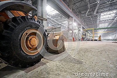 Nizhny Novgorod, Russia - October 30 2019. Plant KM PRECAST. Large construction machinery, tractor pouring sand Editorial Stock Photo