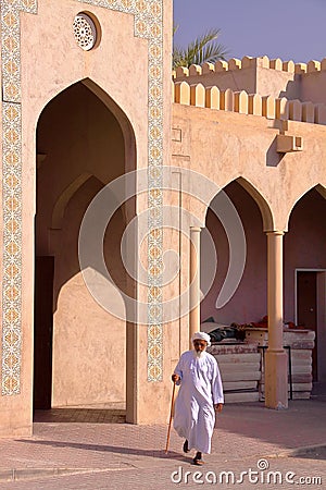 NIZWA, OMAN - FEBRUARY 2, 2012: An Omani old man traditionally dressed in Nizwa Old Town Editorial Stock Photo