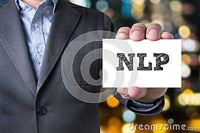 NLP letters (or Neuro Linguistic Programming) on the card shown Stock Photo