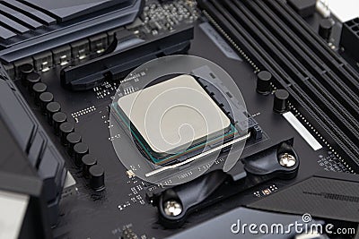 7 nm Computer processor CPU inserted in a motherboard socket Stock Photo