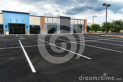 No Customers and Empty Parking Lot at Retail Shopping Center Stock Photo