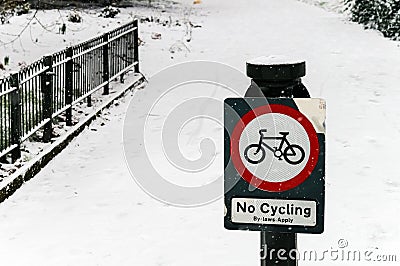 No Cycling Sign in a Park, Snowy Day Stock Photo