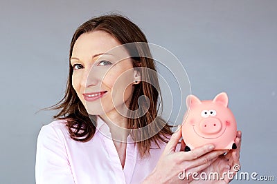 Money savings no stress woman holding moneybox piggy bank Stock Photo