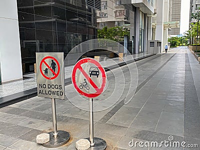 No dog allowed and parking restriction sign in common walking area Stock Photo