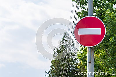 No entry sign, or brick, prohibits the entry of any vehicle in a direction that overlaps this road sign Stock Photo