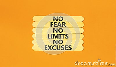 No fear limits excuses symbol. Concept words No fear no limits no excuses on wooden stick. Beautiful orange table orange Stock Photo