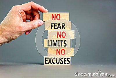 No fear limits excuses symbol. Concept words No fear no limits no excuses on wooden blocks. Beautiful grey table grey background. Stock Photo