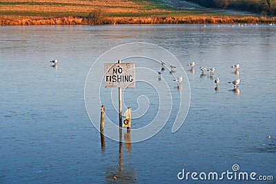 No fishing... ...in the frozen lake. Stock Photo