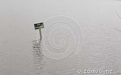 No fishing sign on calm lake or pond with space for copy Stock Photo