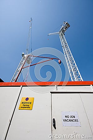 No Job Vacancies sign by building site Stock Photo