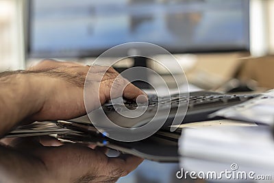 A man typing bluetooth keyboard Stock Photo