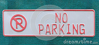 No parking sign on blue woven fabric. Stock Photo