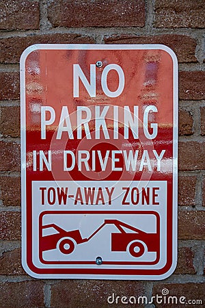 No parking sign on brink wall Stock Photo