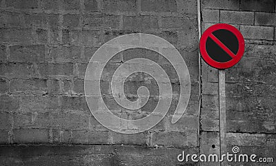 No parking sign. Regulatory sign. Circle red and black no parking sign on post. Traffic sign on gray and white brick wall texture Stock Photo