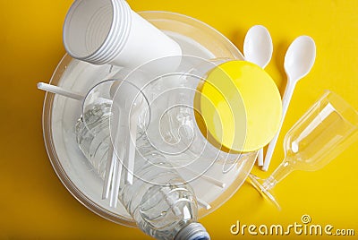 No Plastic Recycle Concept Whitel Plastic Dishes Plates Cups Spoon Isoalted Yellow background Copy Space Top View Stock Photo