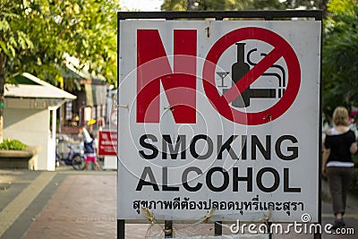 No smoking no alcohol sign in the streets of Bangkok, written in English and Thai language Editorial Stock Photo