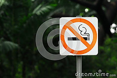 No Smoking Sign with steel pole is in a Public Park Stock Photo