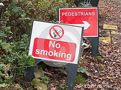 No smoking warning plastic sign floor road pedestrians direction Stock Photo