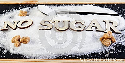No sugar text from letters, sugar slide on a spoon, suggesting a diet and health concept Stock Photo