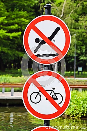 No swimming and no cycling signs Stock Photo