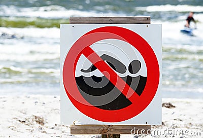 No swimming sign on beach Stock Photo