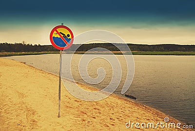 No swimming sign over a lake Stock Photo