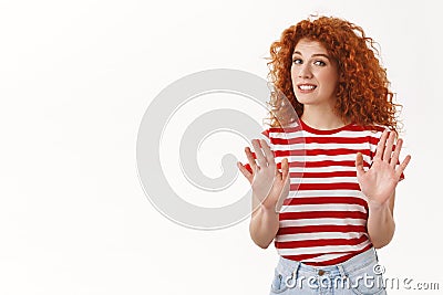 No thanks pass. Reluctant fashionable redhead curly girl 25s ginger hair wave raised hands refusal aversion gesture Stock Photo