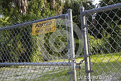 No Trespassing sign on Fence Stock Photo