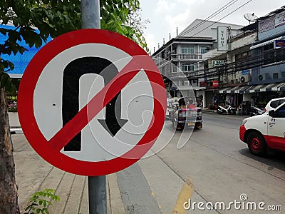 The No U-turn sign is on the sidewalk. Editorial Stock Photo