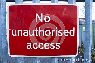 A no unauthorised access sign strap to a gate for no access Stock Photo