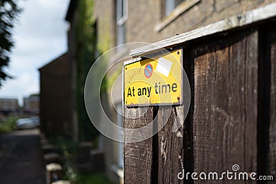 No Waiting sign attached to a private fence down a very narrow, one way street Editorial Stock Photo