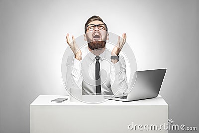 No way! Portrait of emotional scared young manager in white shirt and black tie are sitting in office and screaming and crying Stock Photo