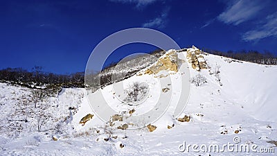 Noboribetsu onsen snow mountain bluesky hell valley winter Stock Photo