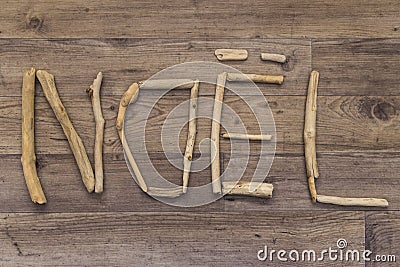 Noel spelt with driftwood Stock Photo