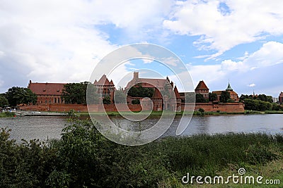 The Nogat river and Malbork Castle, which was built by the Teutonic Knights in the town of Malbork, Poland Editorial Stock Photo