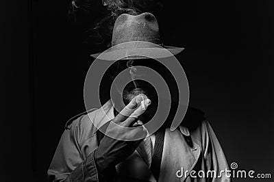 Noir film character smoking a cigarette Stock Photo