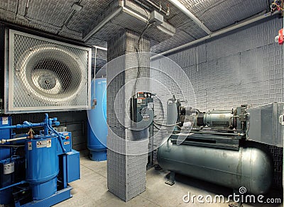 Noise reduction in a manufacturing plant mechanical room. Stock Photo