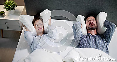 Noisy Neighbor And Couple In Bed Stock Photo