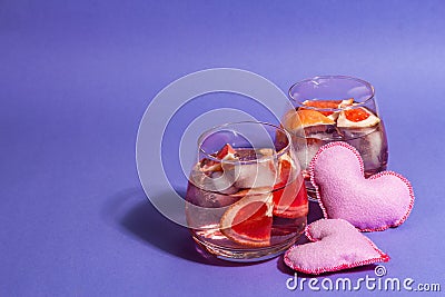 Non-alcoholic cocktail with grapefruit. An iced drink is served in glasses. St.Valentine`s symbol Stock Photo