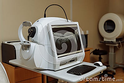 Non-contact optical coherence tomograph for visualization of the anterior and posterior segments of the eyeball. Medical equipment Stock Photo