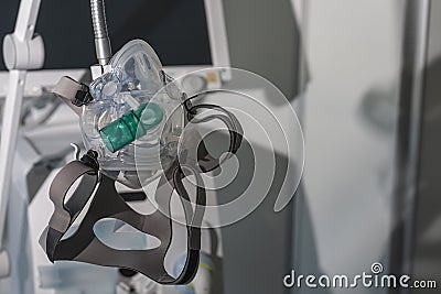 Non-invasive ventilation face mask, on background medical ventilator in ICU n hospital Stock Photo