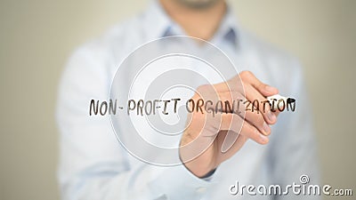 Non Profit Organization, Man writing on transparent screen Stock Photo