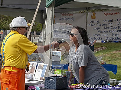 Non-Profit Participant Interviewed during the Rubber Duck Festival. Editorial Stock Photo