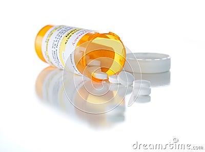 Non-Proprietary Medicine Prescription Bottle and Spilled Pills I Stock Photo