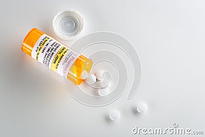 Non-Proprietary Medicine Prescription Bottle and Spilled Pills Stock Photo