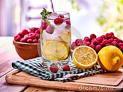Nonalcoholic cocktails with lemon slice and raspberries with mint leaf. Stock Photo