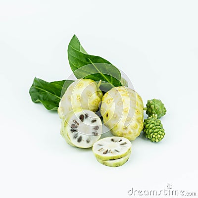 Noni or Morinda Citrifolia fruits with sliced and green leaf on white background Stock Photo