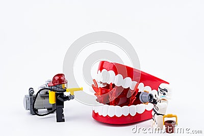 Nonthabure, Thailand - May, 17, 2017 : Lego Fireman and Lego stormtrooper helping extinguish the fire in the red plastic Editorial Stock Photo